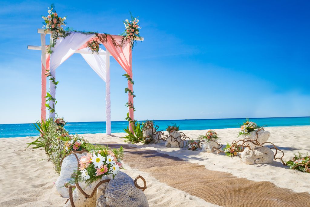 Wedding,Arch,Decorated,With,Flowers,On,Tropical,Sand,Beach,,Outdoor
